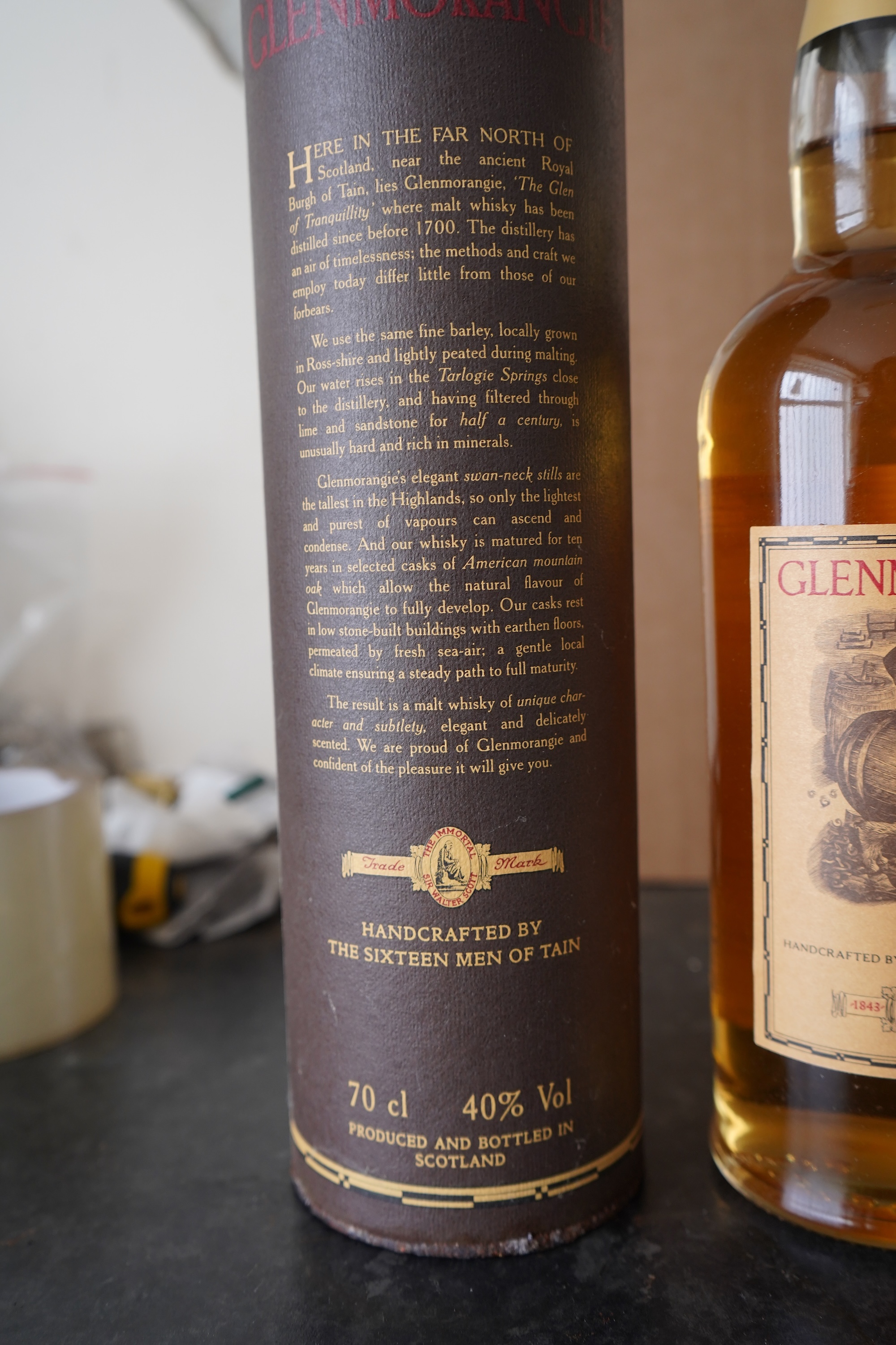 Three bottles of malt whisky: Glenmorangie, Glenfiddich and Grants